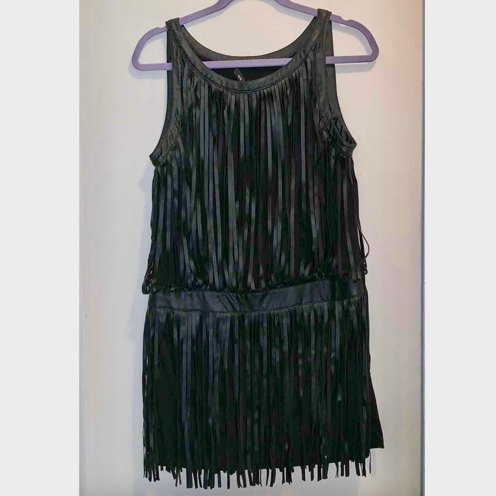 Flirty and fun little fringed black dress